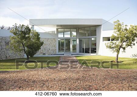 Stone walkway to modern house View Large Photo Image Stock Image - Stone walkway to modern house. Fotosearch