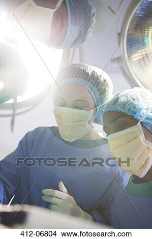 Surgeons working in operating room View Large Photo Image Picture - Surgeons working in operating room. Fotosearch