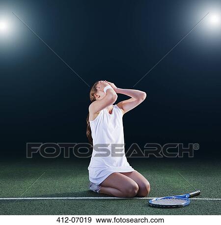 Tennis player crying on court View Large Photo Image Stock Photo - Tennis player crying on court. Fotosearch