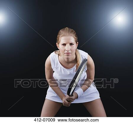 Stock Photo - Tennis player poised in game. Fotosearch