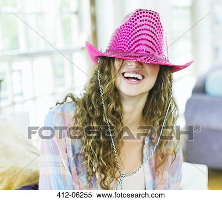 Woman wearing cowboy hat over her eyes View Large Photo Image Stock Photography - Woman wearing cowboy hat over her eyes. Fotosearch