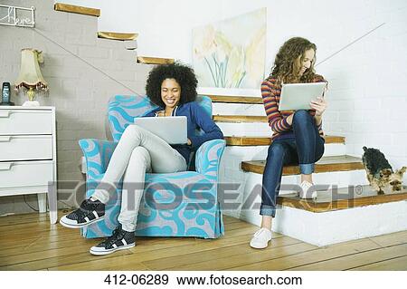 Stock Photo - Women relaxing together on steps. Fotosearch