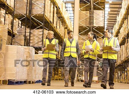 Workers talking in warehouse View Large Photo Image Stock Image - Workers talking in warehouse. Fotosearch