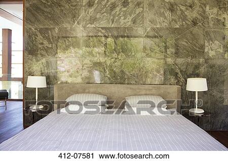 Bed in modern bedroom View Large Photo Image Stock Image - Bed in modern bedroom. Fotosearch