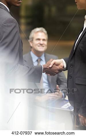 Business people handshaking View Large Photo Image Stock Photo - Business people handshaking. Fotosearch