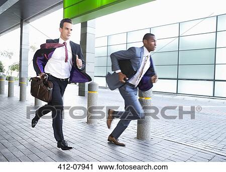 Stock Image - Businessmen running. Fotosearch