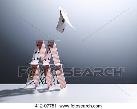 Cards jumping from house of cards View Large Photo Image Stock Image - Cards jumping from house of cards. Fotosearch