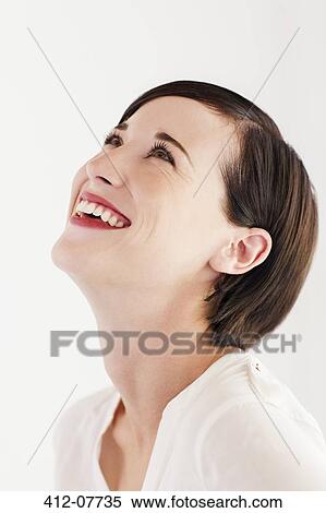 Stock Photography - Close up portrait of smiling woman with head back. Fotosearch