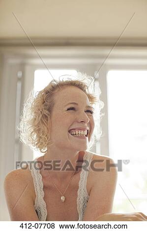 Stock Photo - Enthusiastic woman looking up. Fotosearch