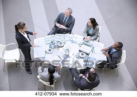 Picture - High angle view of gesturing businesswoman leading meeting. Fotosearch
