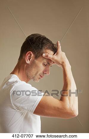 Man holding head in pain View Large Photo Image Stock Photo - Man holding head in pain. Fotosearch