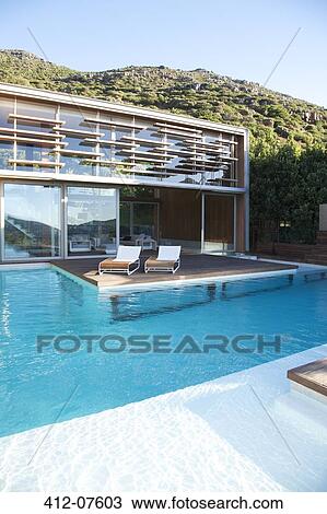 Modern house and swimming pool View Large Photo Image Stock Image - Modern house and swimming pool. Fotosearch