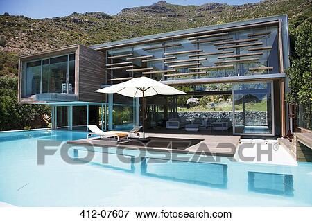 Stock Photo - Modern house and swimming pool. Fotosearch