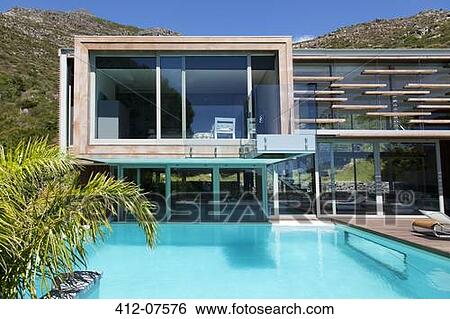 Modern house and swimming pool View Large Photo Image Stock Photograph - Modern house and swimming pool. Fotosearch