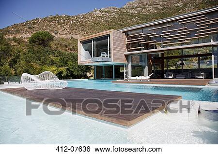 Modern house and swimming pool View Large Photo Image Stock Photograph - Modern house and swimming pool. Fotosearch