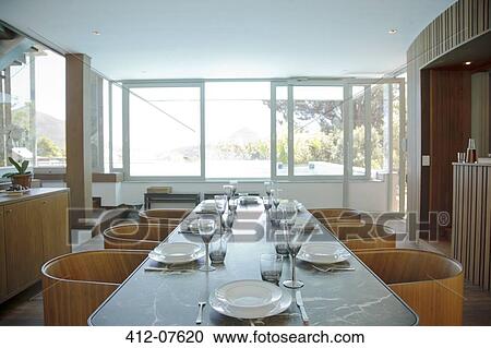 Place settings on table in luxury dining room View Large Photo Image Stock Image - Place settings on table in luxury dining room. Fotosearch
