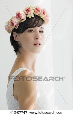 Portrait of serious bride wearing rose wreath on head View Large Photo Image Stock Photo - Portrait of serious bride wearing rose wreath on head. Fotosearch