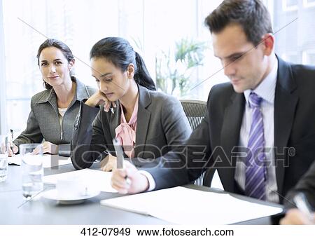 Portrait of smiling businesswoman in meeting View Large Photo Image Stock Photo - Portrait of smiling businesswoman in meeting. Fotosearch