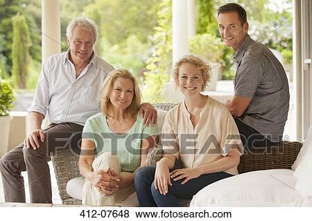 Portrait of smiling couples on patio View Large Photo Image Stock Photo - Portrait of smiling couples on patio. Fotosearch