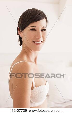 Portrait of smiling woman in bra View Large Photo Image Stock Photo - Portrait of smiling woman in bra. Fotosearch