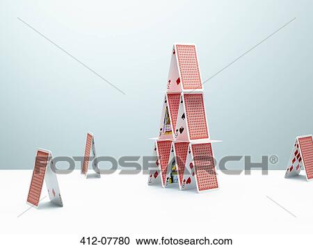 Small houses of cards surrounding large house of cards View Large Photo Image Stock Image - Small houses of cards surrounding large house of cards. Fotosearch