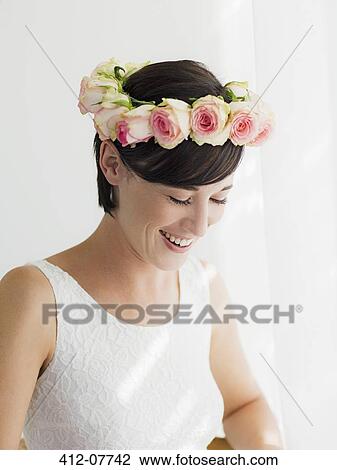 Smiling bride wearing rose wreath on head View Large Photo Image Stock Image - Smiling bride wearing rose wreath on head. Fotosearch