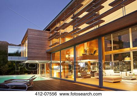 Swimming pool and modern house at night View Large Photo Image Stock Photograph - Swimming pool and modern house at night. Fotosearch