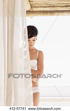 Woman in bra and underwear behind curtain View Large Photo Image Stock Image - Woman in bra and underwear behind curtain. Fotosearch