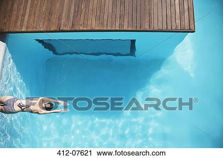 Woman in luxury swimming pool View Large Photo Image Stock Image - Woman in luxury swimming pool. Fotosearch