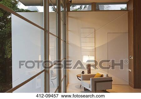 Armchair and lamp in modern living room View Large Photo Image Stock Photo - Armchair and lamp in modern living room. Fotosearch