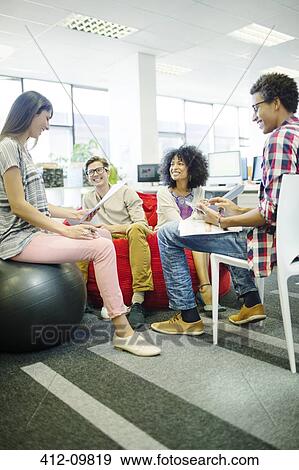 Stock Photo - Business people talking in meeting. Fotosearch
