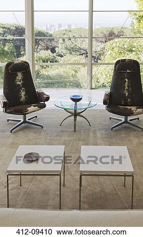 Chairs and tables in modern living room View Large Photo Image Stock Image - Chairs and tables in modern living room. Fotosearch