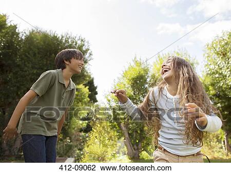 Stock Image - Children playing on trampoline. Fotosearch