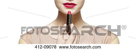 Close up of woman applying red lipstick View Large Photo Image Stock Photo - Close up of woman applying red lipstick. Fotosearch