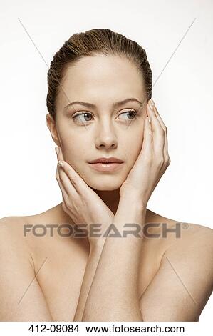 Close up of woman holding her face View Large Photo Image Picture - Close up of woman holding her face. Fotosearch