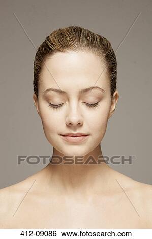 Close up of woman with eyes closed View Large Photo Image Stock Photograph - Close up of woman with eyes closed. Fotosearch