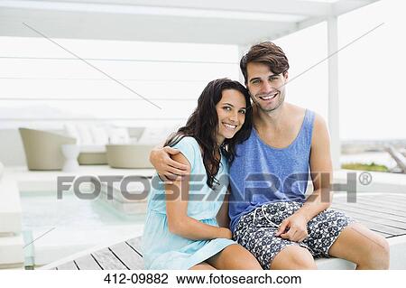 Couple hugging on patio View Large Photo Image Stock Image - Couple hugging on patio. Fotosearch