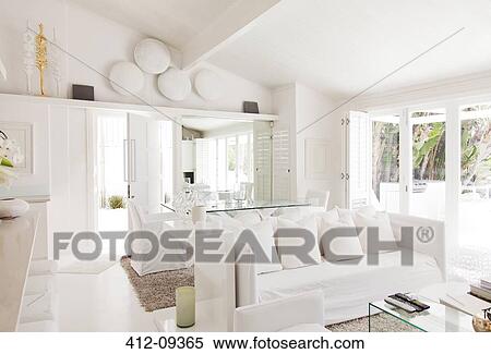 Dining table and living room in modern home View Large Photo Image Stock Photography - Dining table and living room in modern home. Fotosearch