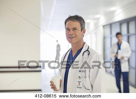 Doctor smiling in hospital View Large Photo Image Stock Photography - Doctor smiling in hospital. Fotosearch