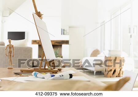 Easel and paint tubes on table View Large Photo Image Stock Photography - Easel and paint tubes on table. Fotosearch