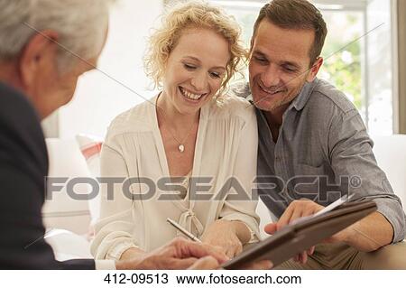 Financial advisor meeting with couple View Large Photo Image Stock Image - Financial advisor meeting with couple. Fotosearch