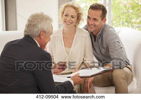 Picture - Financial advisor talking with clients. Fotosearch