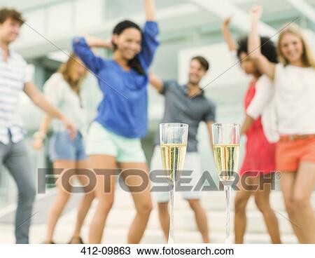Friends dancing at party View Large Photo Image Stock Image - Friends dancing at party. Fotosearch