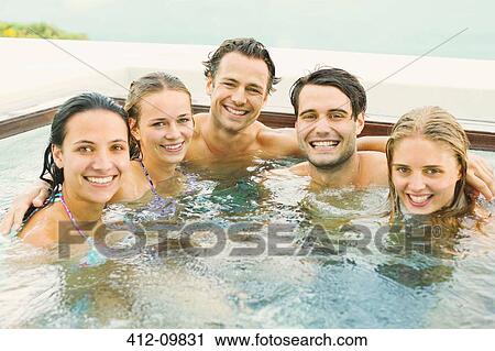 Friends smiling together in hot tub View Large Photo Image Stock Image - Friends smiling together in hot tub. Fotosearch