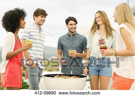 Friends talking at barbecue View Large Photo Image Stock Image - Friends talking at barbecue. Fotosearch