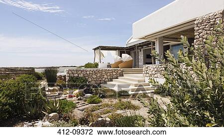 Landscaping around modern house View Large Photo Image Stock Image - Landscaping around modern house. Fotosearch