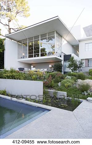 Landscaping in front of modern house View Large Photo Image Stock Photography - Landscaping in front of modern house. Fotosearch
