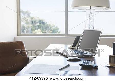 Stock Photography - Laptop on desk in office. Fotosearch