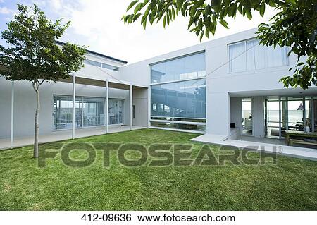 Lawn in front of modern house View Large Photo Image Stock Photograph - Lawn in front of modern house. Fotosearch