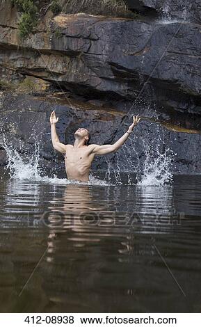 Man splashing in pool View Large Photo Image Stock Photo - Man splashing in pool. Fotosearch